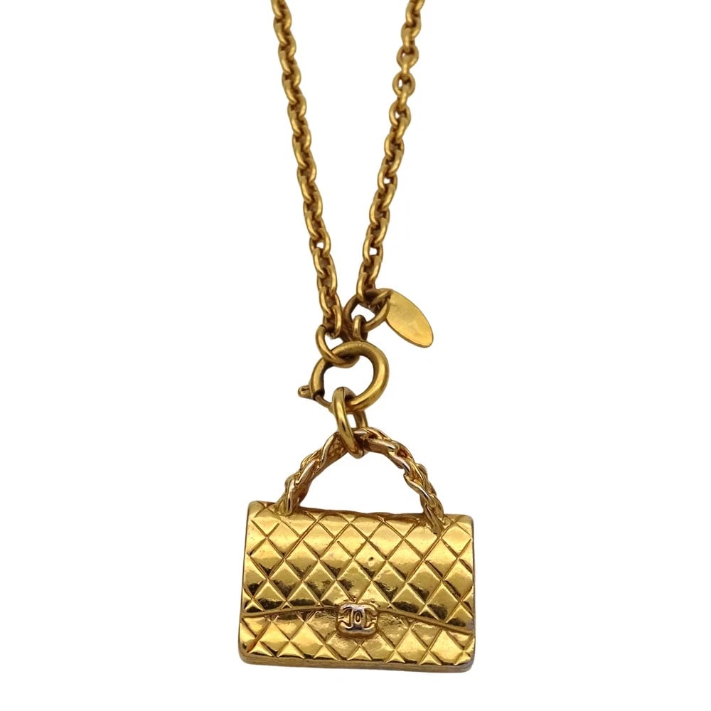CHANEL NECKLACE MATELASSE BAG MOTIF GP GOLD PLATED: Chanel Necklace Matelasse Bag Motif GP Gold Plated Brand: Chanel Type/Style: Necklace Material: GP, Color: GOLD Size: Measurements: Top Height: Approx. 32.1mm Top Width: Approx. 30.7mm Chain Length: A