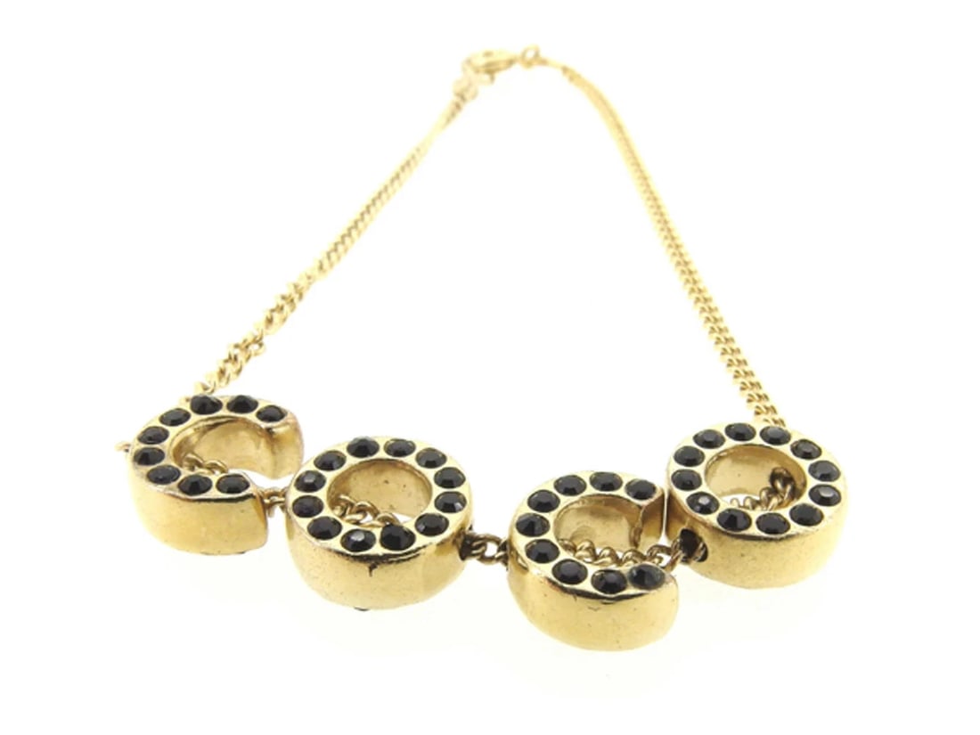 CHANEL BRACELET COCO GOLD BLACK STONES GOLD PLATING: CHANEL Bracelet COCO Gold Black stones Gold plating Brand: CHANEL Type/Style: Bracelet Material: Gold plating, Color: Gold ,Black Size: Total length: approx. 19 cm Width: approx. 0.1 cm to 0.9 cm Wris