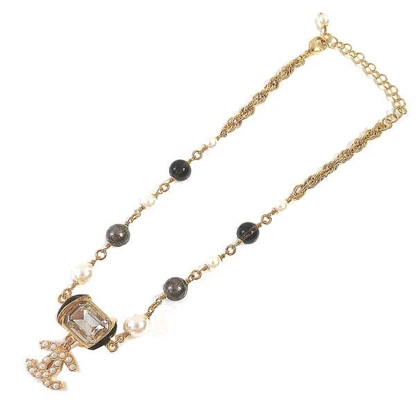 CHANEL NECKLACE WOMEN CC MARK PEARL GOLD BLACK WHITE: Chanel Necklace Women CC Mark Pearl Gold Black White Brand: CHANEL Type/Style: Necklace Material: Metal, Rhinestone, Color: Gold ,Black,White Size: Size of CC mark (including crystal) approx. W2 x H3 