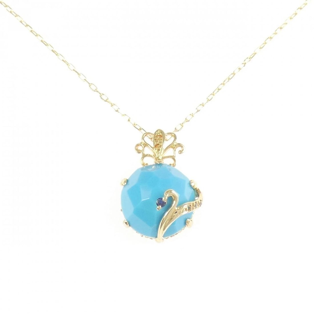 K18YG COLOR STONE NECKLACE: K18YG Color Stone Necklace Brand: Unbranded Type/Style: Turquoise Necklace Material: K18 Yellow Gold, Main Stone/Creation TurquoiseSecondary Stone Diamond (Inner) / Sapphire / Garnet Color: Yellow