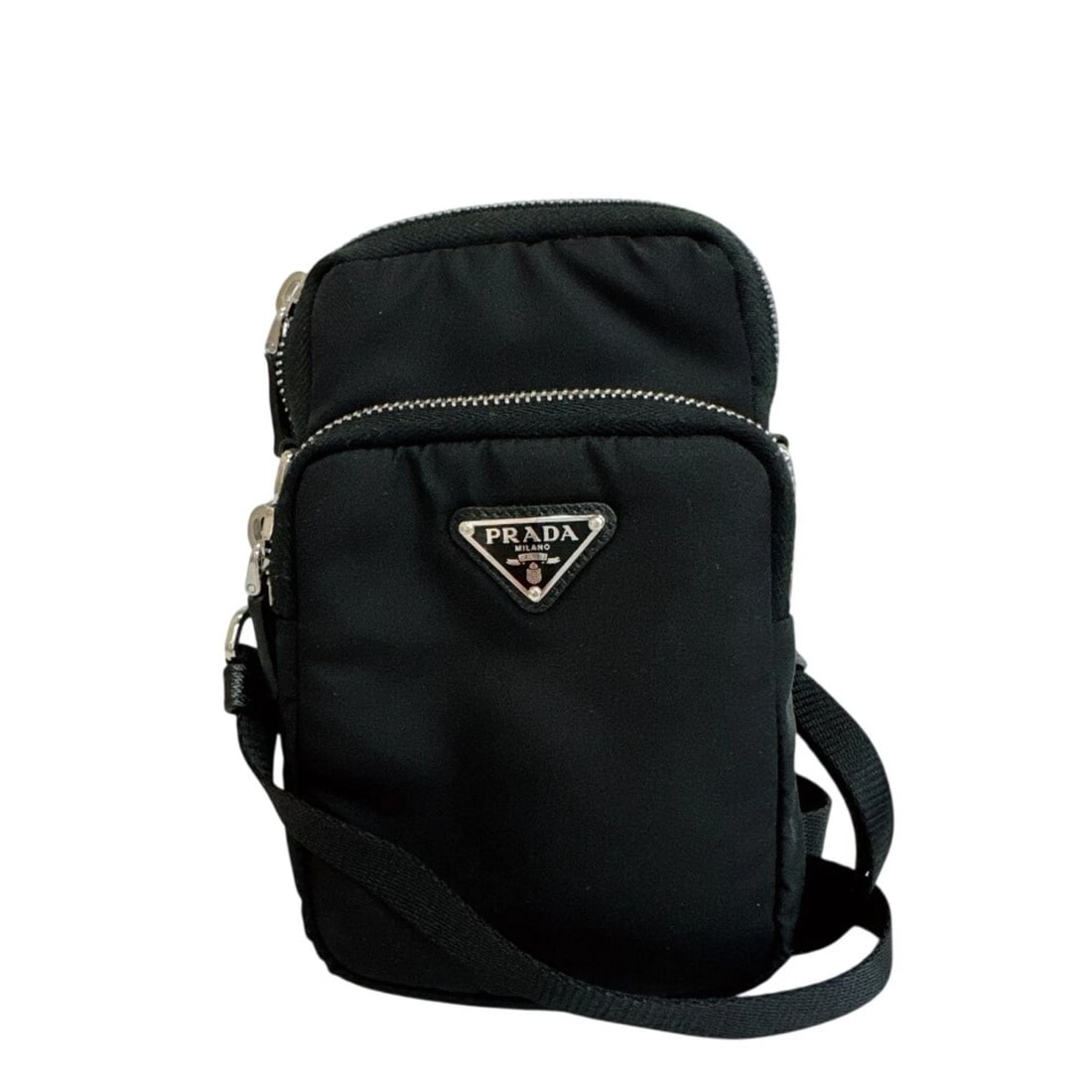PRADA RE-NYLON SMARTPHONE CASE WITH TRIANGLE LOGO SHOULDER: PRADA Re-Nylon Smartphone Case with Triangle Logo Shoulder Brand: Prada Type/Style: Shoulder bag Material: Nylon Color: Black Size: (HxWxD)17cm x 11cm / 6.69'' x 4.33'' Accessories: None A