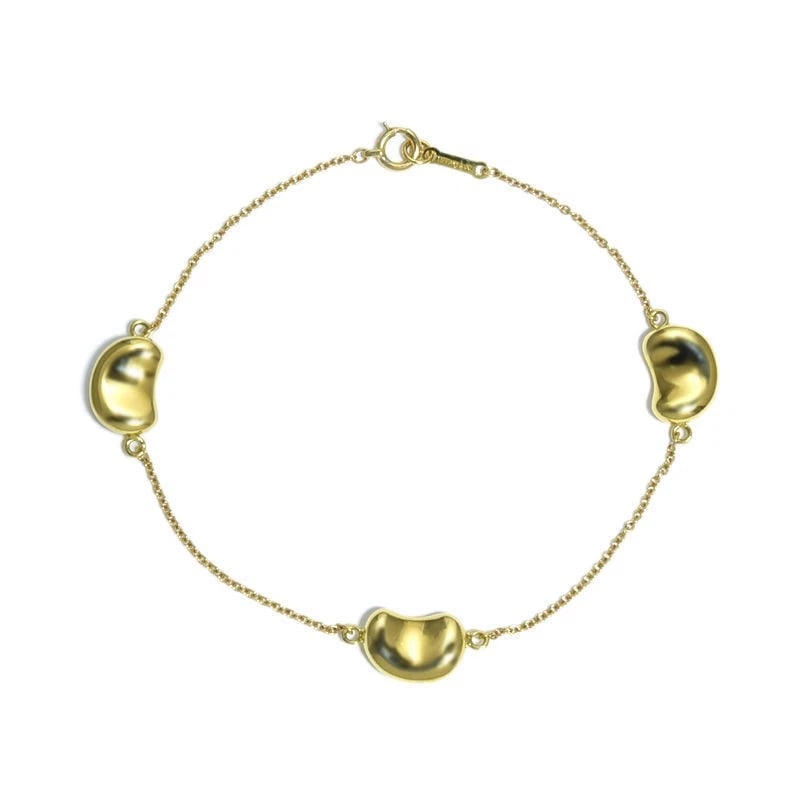 TIFFANY & CO. BEAN DESIGN BRACELET: Tiffany & Co. Bean design bracelet Brand: Tiffany & Co. Type/Style: Bracelet Material: 18K YG Color: YG Size: Size Effective length 17.2cm Chain width 1.0mm Motif 10.7mm x 7.5mm Accessories: None