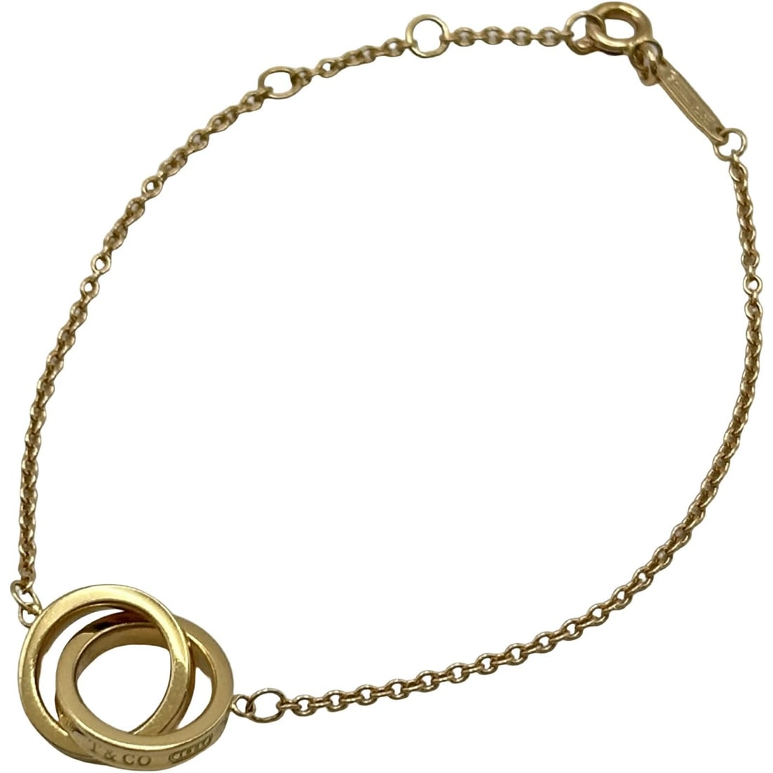 TIFFANY & CO. INTERLOCKING BRACELET PINK GOLD AU750 JEWELRY: Tiffany & Co. Interlocking Bracelet Pink Gold Au750 Jewelry Brand: Tiffany & Co. Type/Style: Bracelet Material: 18K PG Color: PG Size: Size Height: approx. 11.6mm Width: approx. 21.5mm Arm circumferen