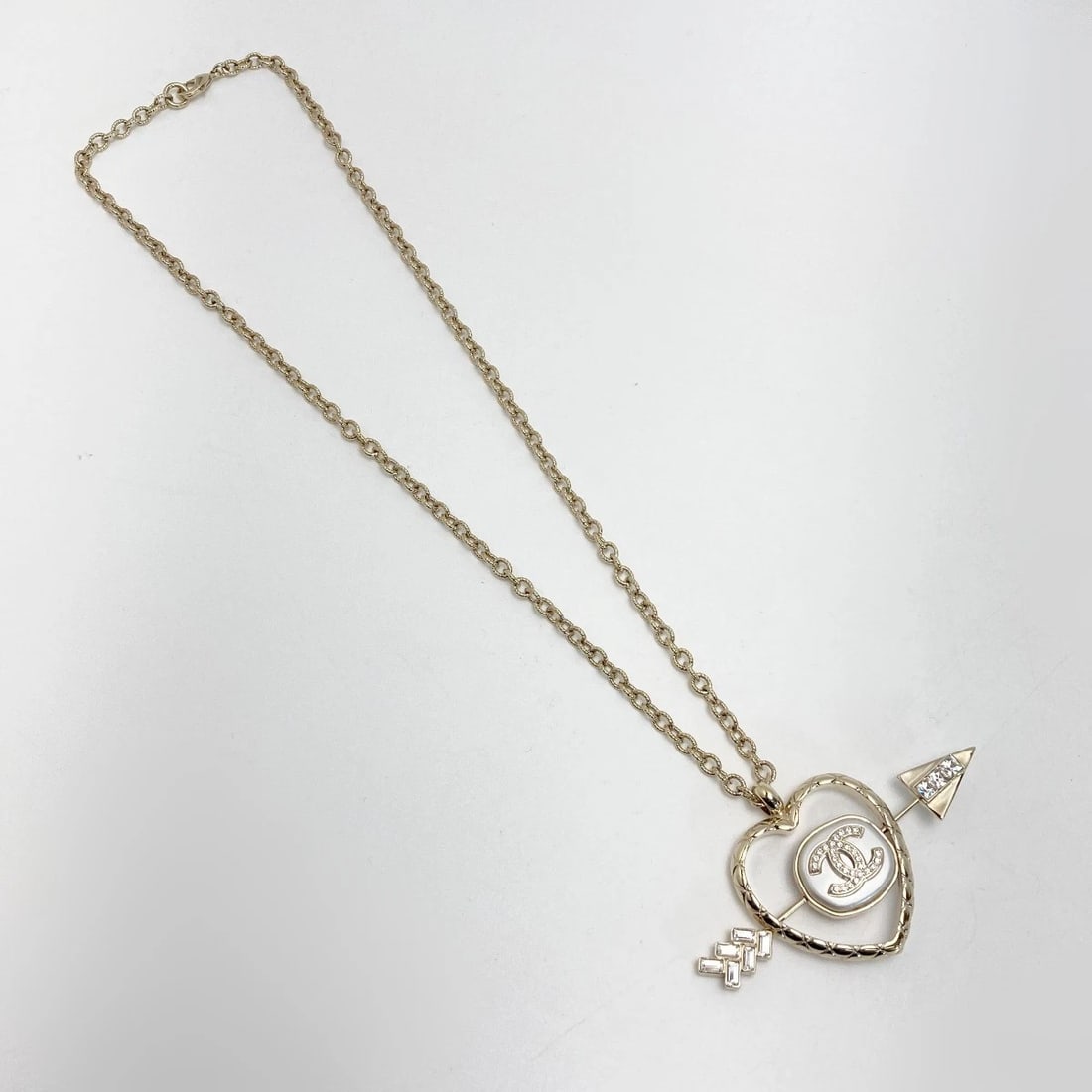 CHANEL NECKLACE COCO MARK HEART ARROW GOLD GP RHINESTONES: CHANEL Necklace Coco Mark Heart Arrow Gold GP Rhinestones Brand: CHANEL Type/Style: Necklace Material: GP, Color: GOLD Size: Approx. (Top) 50mm x 85mm Accessories: None Accessories Notice: