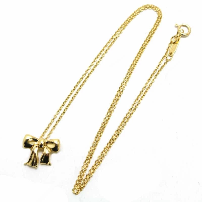 TIFFANY & CO. BLUE BOX BOW NECKLACE RIBBON MOTIF 18K YELLOW GOLD K18YG: Tiffany & Co. Blue Box Bow Necklace Ribbon Motif 18K Yellow Gold K18YG Brand: Tiffany & Co. Type/Style: Pendant Material: 18K Yellow Gold (K18YG), Color: yellow gold Size: Chain: approx. 41 cm; Charm: