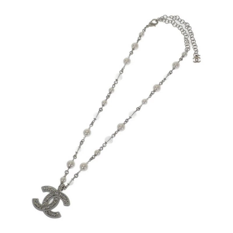 CHANEL CC LONG PENDANT NECKLACE SILVER WITH METAL PEARL AND CRYSTALS: Chanel CC Long Pendant Necklace Silver With Metal Pearl and Crystals Brand: CHANEL Type/Style: Chain Material: Metal / Faux Pearl / Crystal, Color: SILVER Size: Motif: Width: Approx. 37mm x Height: Ap