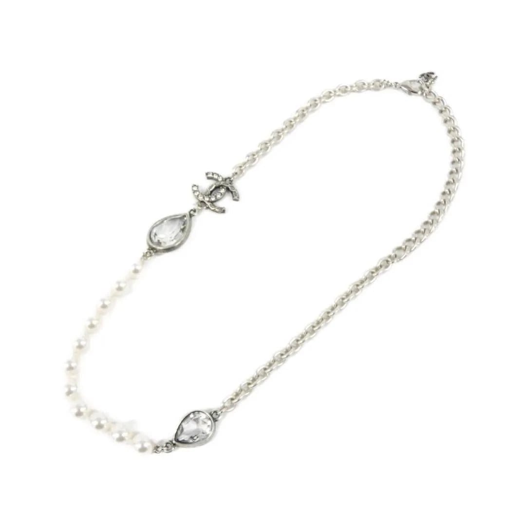 CHANEL COCO MARK PEARL NECKLACE SILVER WHITE + CRYSTAL / SILVER: CHANEL Coco Mark Pearl Necklace Silver White + Crystal / Silver Brand: CHANEL Type/Style: Pearl Material: Faux Pearl, Color: WHITE+CRYSTAL / SILVER Hardware Size: Length: 38-48cmMotif Width x Height: 