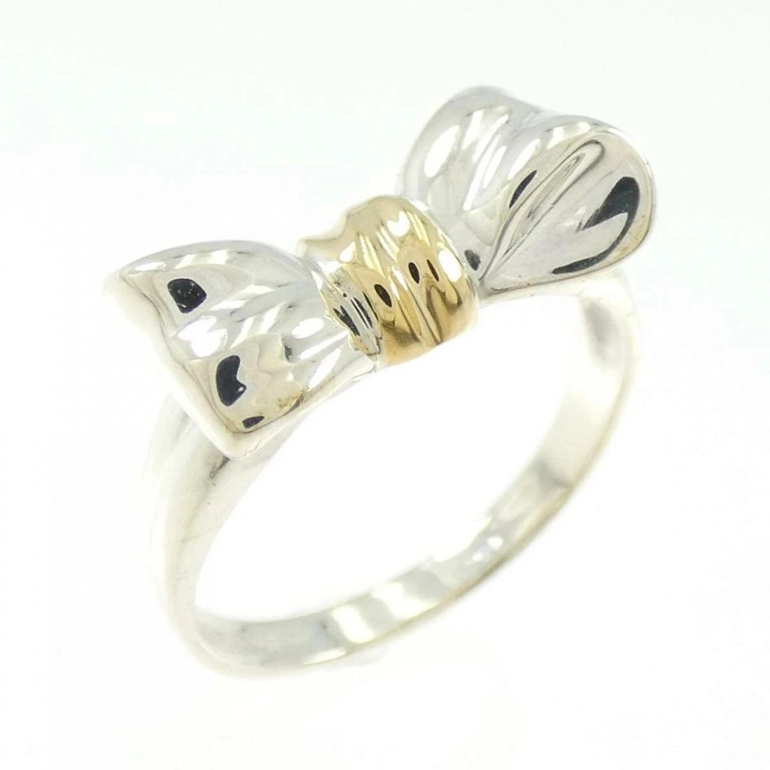 TIFFANY RIBBON RING 925 SILVER 750 GOLD: Tiffany Ribbon Ring 925 Silver 750 Gold Brand: Tiffany & Co. Type/Style: Ring Material: 925 Silver 750 Gold Color: YG,Silver Size: US 6.75 Accessories: None Accessories Notice: When purchasing