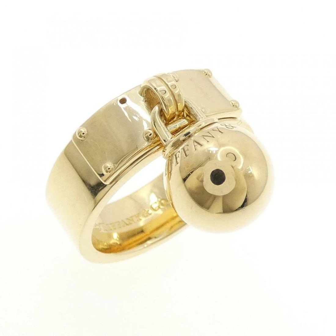 TIFFANY GOLD BALL DANGLE RING: Tiffany Gold Ball Dangle Ring Brand: Tiffany & Co. Type/Style: Ring Material: 750 Yellow Gold Color: yelllow gold Size: US 6.75 Accessories: None Accessories Notice: When purchasing pre-owned goods,