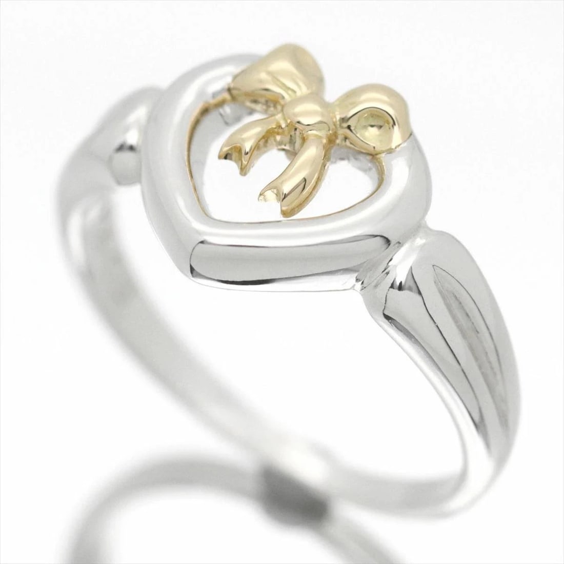 TIFFANY & CO HEART RIBBON GOLD RING: Tiffany & Co Heart Ribbon Gold Ring Brand: Tiffany & Co. Type/Style: Ring Material: Ag925 / K18YG Color: YG,Silver Size: US 3.5 Accessories: None Accessories Notice: When purchasing pre-owned goods,