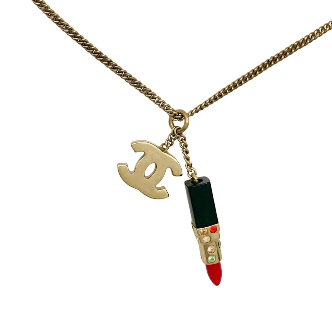 CHANEL NECKLACE LIPSTICK & LIP COSMETICS MULTICOLOR: Chanel Necklace Lipstick & Lip Cosmetics Multicolor Brand: CHANEL Type/Style: Necklace Material: Gold plating Multi-colored stones Plastic Color: Gold, Red, Black Size: Chain Length16.5 in