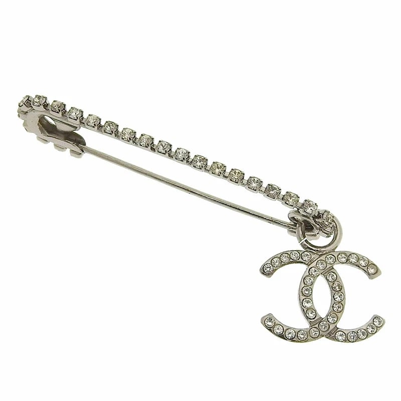 CHANEL BROOCH SILVER RHINESTONE: CHANEL Brooch Silver Rhinestone Brand: CHANEL Type/Style: Brooch Material: Not specified Color: Silver Size: None Accessories: None Accessories Notice: When purchasing pre-owned goods, please refer