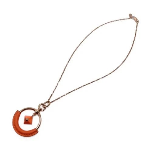 HERMES LOOP MEDOR NECKLACE PM PINK METAL: Hermes Loop Medor Necklace PM Pink Metal Brand: Hermes Type/Style: Necklace Material: Pink Gold Plated Vo Swift Lacquer Color: Pink Gold, Orange Size: Chain lengthapproximately 39.5 cm (15.6 inches). 