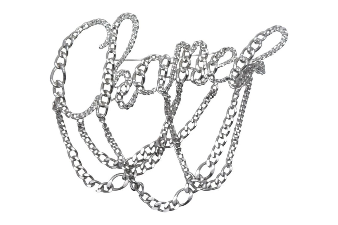 CHANEL SILVER LOGO CHAIN BROOCH: CHANEL Silver Logo Chain Brooch Brand: CHANEL Type/Style: Brooch Material: Not specified Color: Silver Size: None Accessories: None Accessories Notice: When purchasing pre-owned goods, please refer