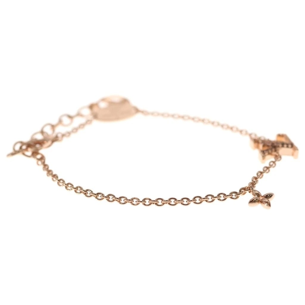 LOUIS VUITTON LV ICONIC LOGO RHINESTONE BRACELET PINK GOLD: Louis Vuitton LV Iconic Logo Rhinestone Bracelet Pink Gold Brand: Louis Vuitton Type/Style: Line Stone Bracelet Material: Not specified Color: Pink Gold Size: Length: 8.1 inches, Max Width: 0.36 inche