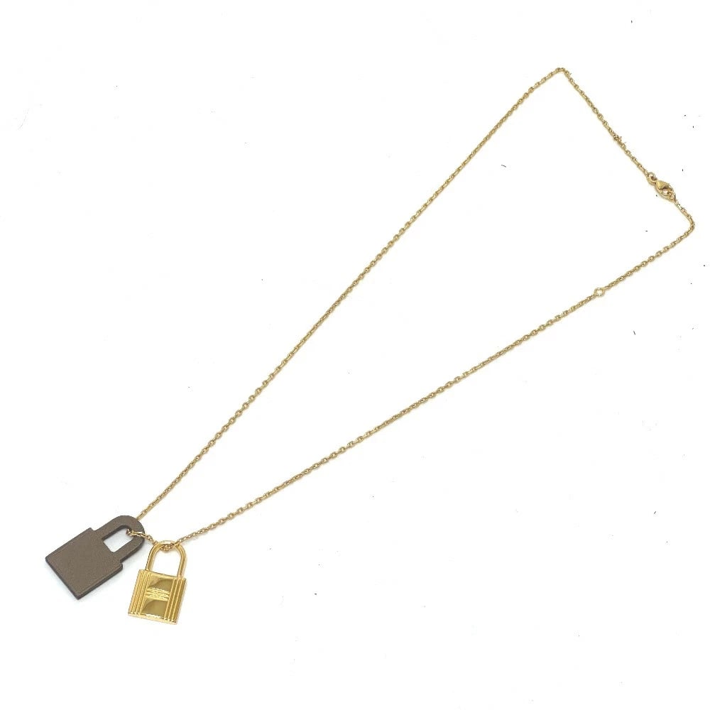HERMES NECKLACE GOLD BROWN: Hermes Necklace Gold Brown Brand: Hermes Type/Style: Necklace Material: Gold hardware Color: Brown Size: length20.5 in Accessories: None Accessories Notice: When purchasing pre-owned goods