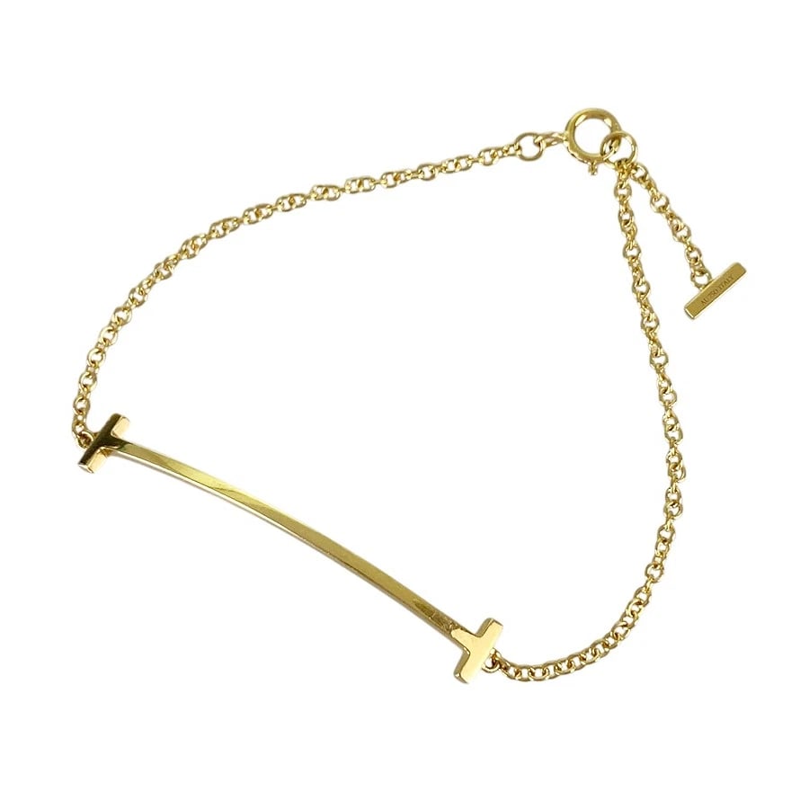 TIFFANY&CO. T SMILE SMALL YELLOW GOLD BRACELET: TIFFANY&Co. T Smile Small Yellow gold Bracelet Brand: TIFFANY&Co. Type/Style: Bracelet Material: 18K Yellow Gold Color: Gold Size: Motif size:5.6mm?37.3mm Wrist Size:15cm Accessories: None