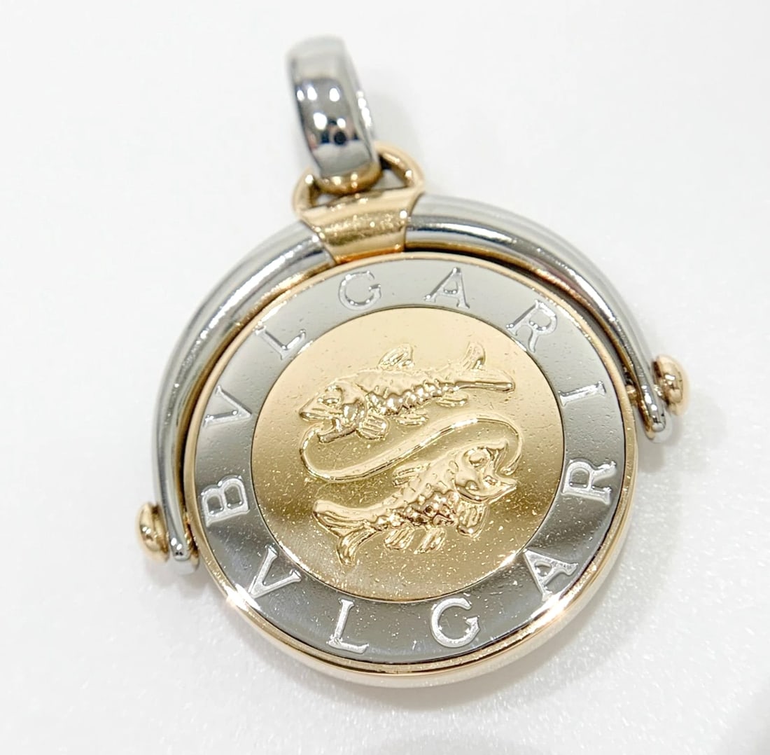 BVLGARI PISCES ZODIAC HOROSCOPE 18K YELLOW GOLD STAINLESS STEEL PENDANT: Bvlgari Pisces Zodiac Horoscope 18k Yellow Gold Stainless Steel Pendant Brand: Bvlgari Type/Style: Pendant Material: 18k Yellow Gold Stainless Steel Color: Gold, Silver Size: Total Size with Bail: App