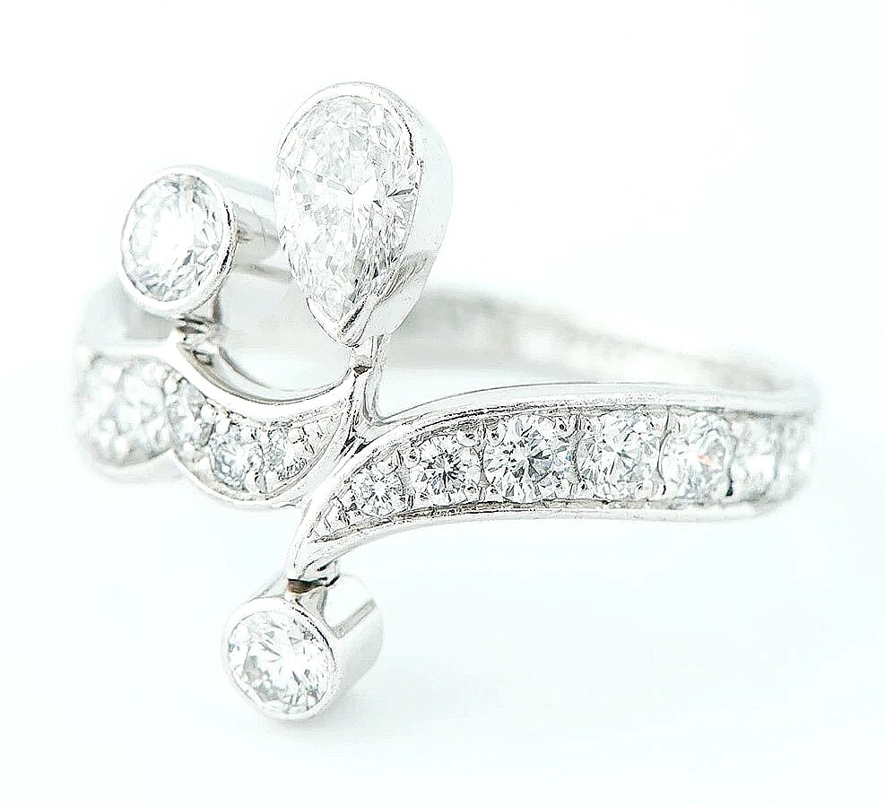 PIAGET MAGIC GARDEN PEAR SHAPE ROUND BRILLIANT DIAMOND BAND RING: Piaget Magic Garden Pear Shape Round Brilliant Diamond Band Ring Brand: Piaget Type/Style: Ring Material: 18k White Gold, Main Stone Natural Color: White Size: US4.75 Accessories: None Acc