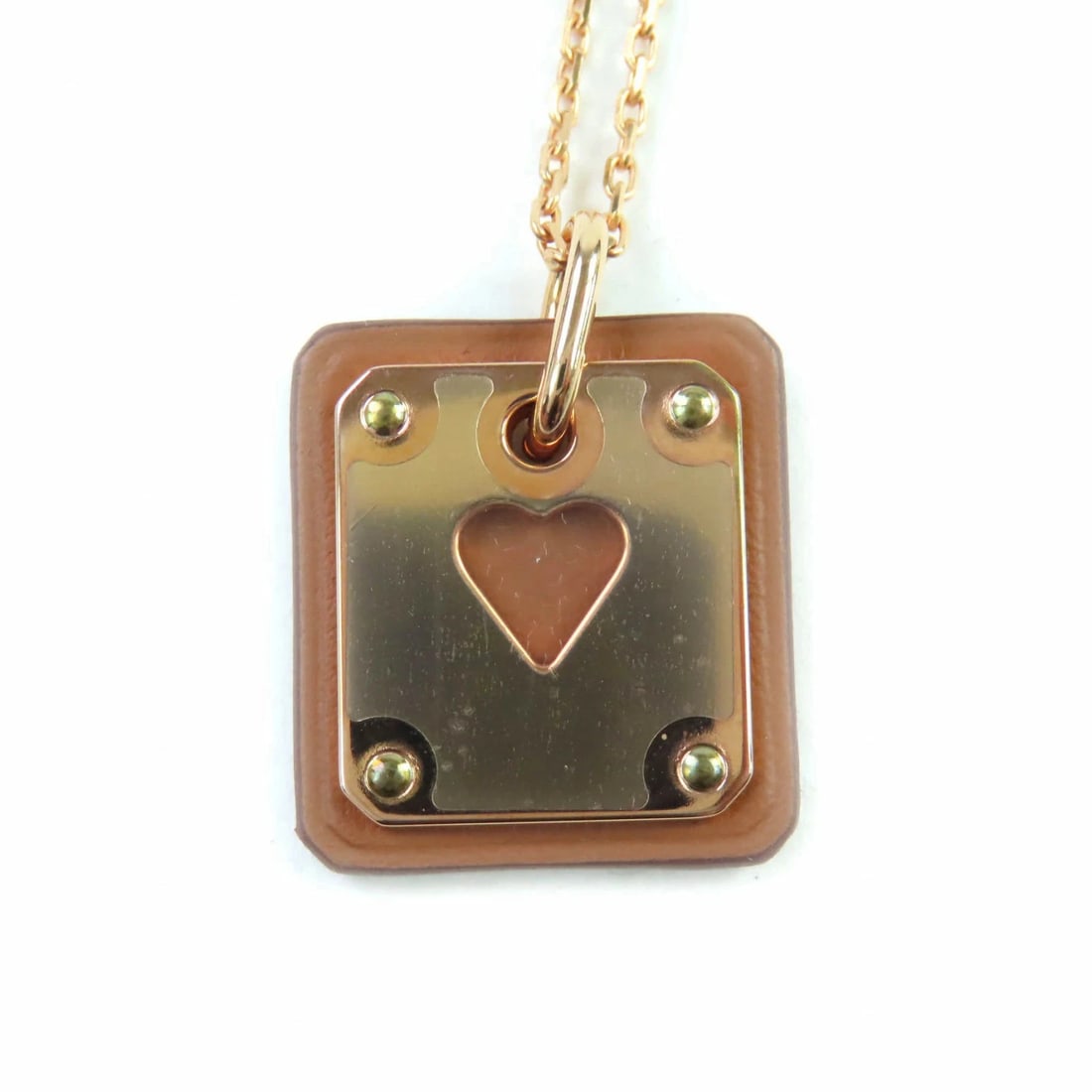 HERMES ASS DE COEUR HEART NECKLACE PINK GOLD BROWN: Hermes Ass de Coeur Heart Necklace Pink Gold Brown Brand: Hermes Type/Style: Necklace Material: Not specified Color: Pink Gold, Brown Size: Pendant: 0.8 in (2cm) x 0.8 in (2cm), Total length: 19.7 in 