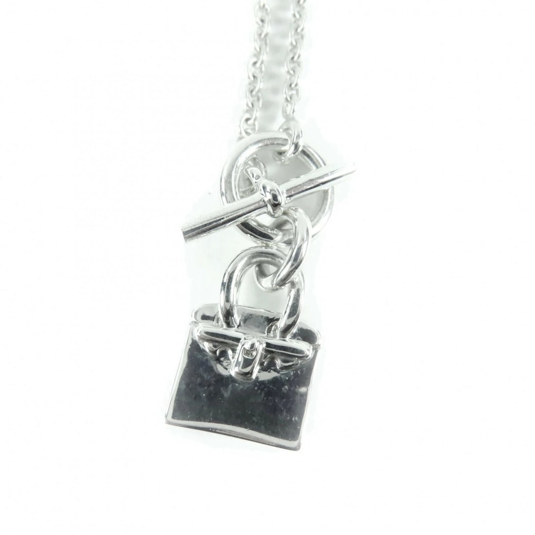 HERMES 925 AMULET BIRKIN NECKLACE PENDANT: Hermes 925 Amulet Birkin Necklace Pendant Brand: Hermes Type/Style: NA Material: 925 silver Color: Silver Size: Top length 0.6 Accessories: None Accessories Notice: When purchasing pre-own