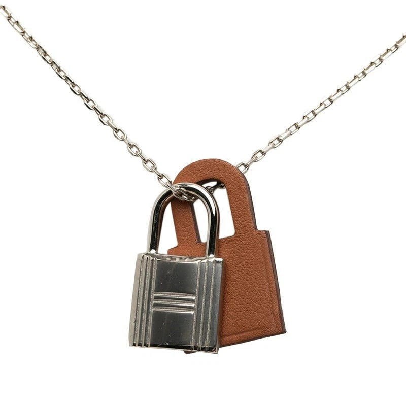 HERMES NECKLACE SILVER & BROWN METAL: Hermes Necklace Silver & Brown Metal Brand: Hermes Type/Style: Necklace Material: Metal Color: Silver, Brown Size: Length approximately 19.3 in, Top W approximately 0.52 in, H Accessories: None