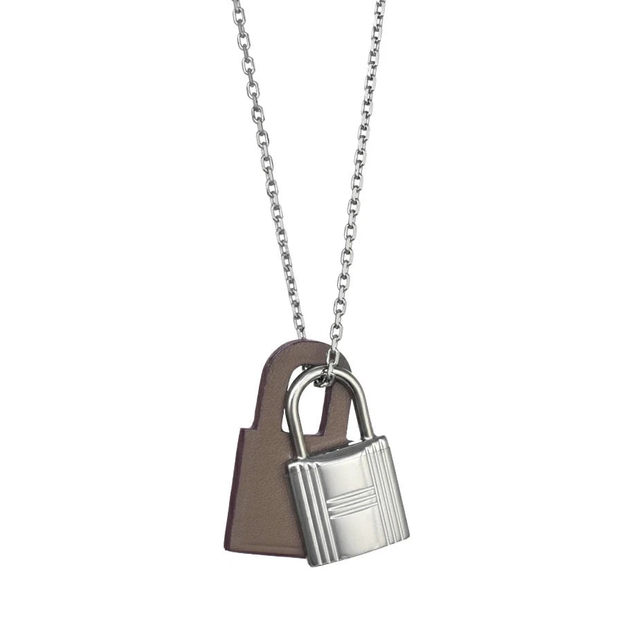 HERMES PENDANT NECKLACE SWIFT LEATHER: Hermes Pendant Necklace Swift Leather Brand: Hermes Type/Style: Necklace Material: Vauquer Swift Palladium Color: Beige, Silver Size: Top: 1.0 in H x 0.6 in W, Chain length: 17.7-19.7 in Accessori