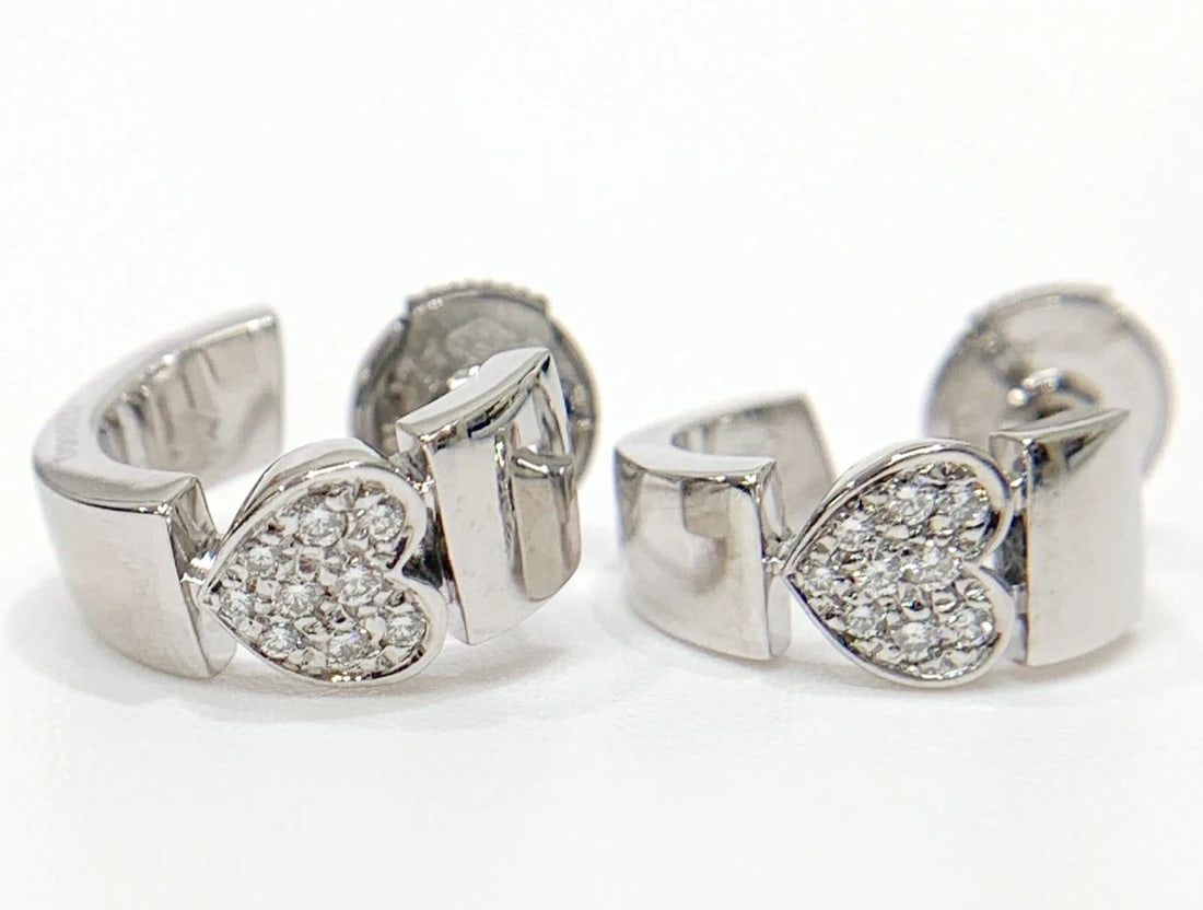 PIAGET HEART DIAMOND PAVE 18K WHITE GOLD HOOP HUGGIE EARRINGS: Piaget Heart Diamond Pave 18k White Gold Hoop Huggie Earrings Brand: Piaget Type/Style: Earrings Material: 18k White Gold, Main Stone Natural Color: White Size: Approx. 0.5 in / 13.9 mm Accessorie