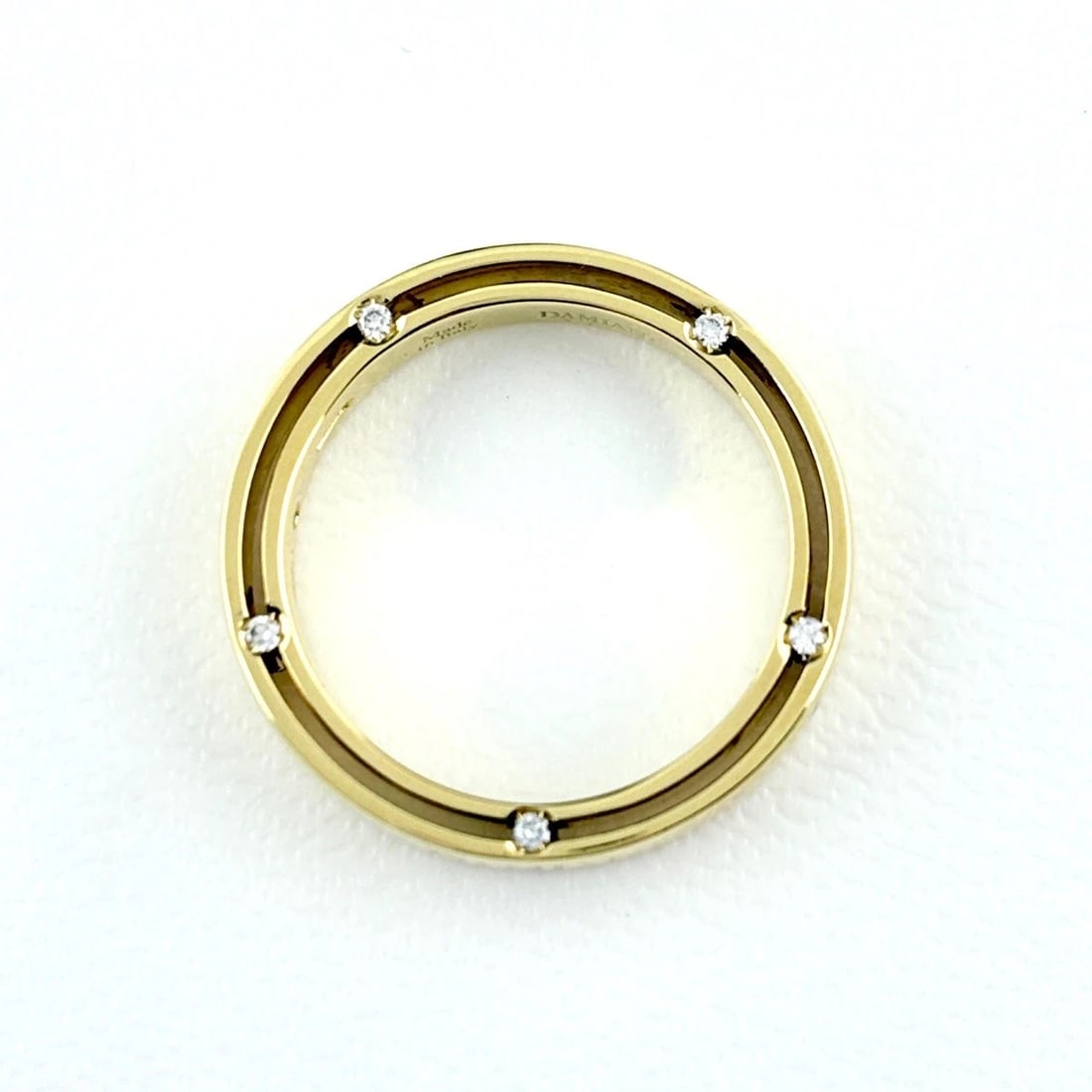 DAMIANI D-SIDE RING: Damiani D-Side Ring Brand: Damiani Type/Style: Ring Material: 18K YG Color: YG Size: US 6 Accessories: None Accessories Notice: When purchasing pre-owned goods, please refer to the photos of the