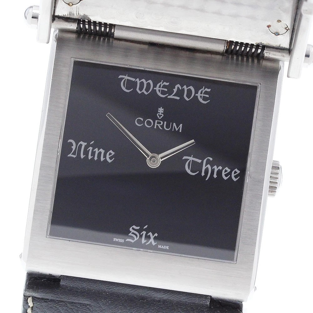 CORUM BUCKINGHAM QUARTZ WATCH: CORUM Buckingham Quartz Watch Brand: CORUM Type/Style: Wristwatch Material: Band Material leather, Case Material Stainless Steel Color: Dial Color black Band Color black Case Color Silver Size: Case