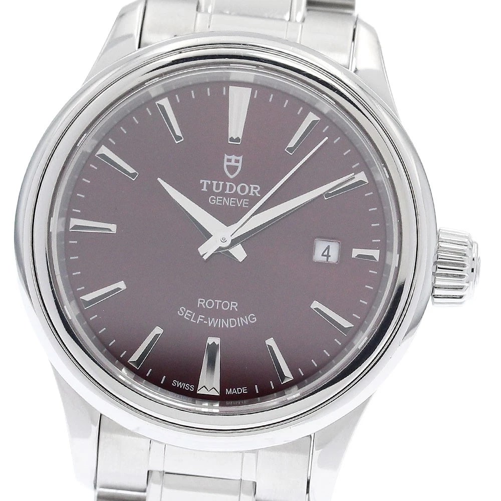 TUDOR DATE BORDEAUX AUTOMATIC WATCH: TUDOR Date Bordeaux Automatic Watch Brand: TUDOR Type/Style: Wristwatch Material: Band Material Stainless Steel, Case Material Stainless Steel Color: Case Color Silver Band Color Silver Dial Color