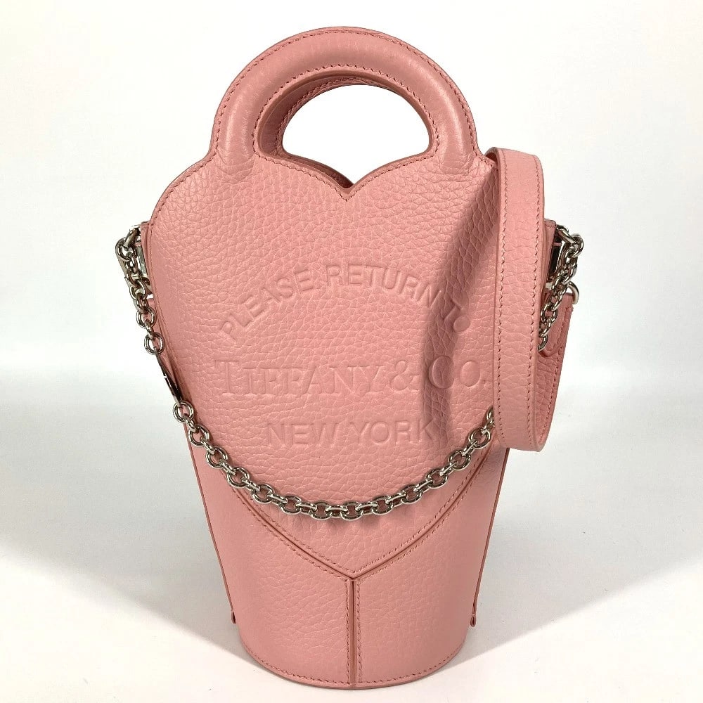 TIFFANY&CO. MINI POCHETTE JAPAN EXCLUSIVE BAG: TIFFANY&Co. Mini Pochette Japan Exclusive Bag Brand: TIFFANY&Co. Type/Style: Shoulder Bag Material: Leather Color: pink Size: W3.7?H9.6?D3.7inch / W9.5cm?H24.5cm?D9.5cm Handle: 5.5inch / 14cm Acce