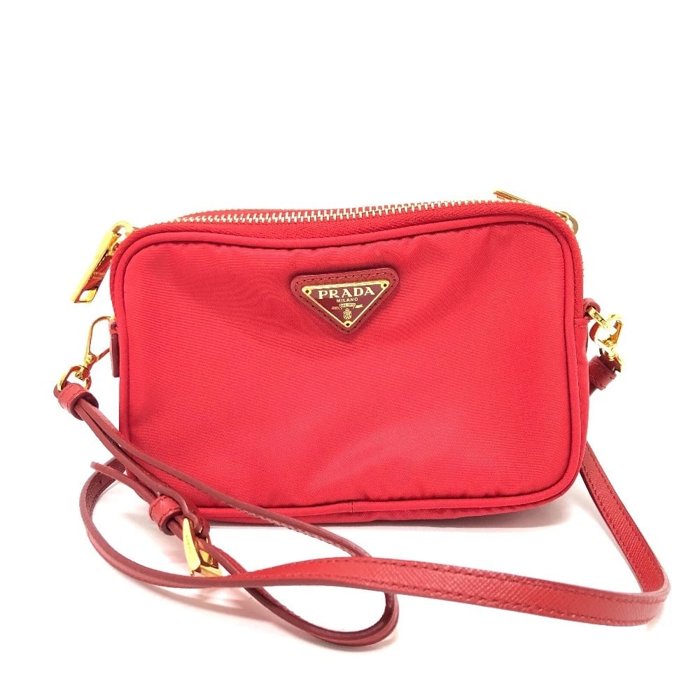 PRADA TRIANGLE LOGO CROSSBODY POCHETTE SHOULDER BAG: PRADA triangle logo Crossbody Pochette Shoulder Bag Brand: PRADA Type/Style: Shoulder Bag Material: Nylon Color: Red Size: W6.3?H3.9?D1.3inch / W16cm?H10cm?D3.4cm Accessories: None Accesso