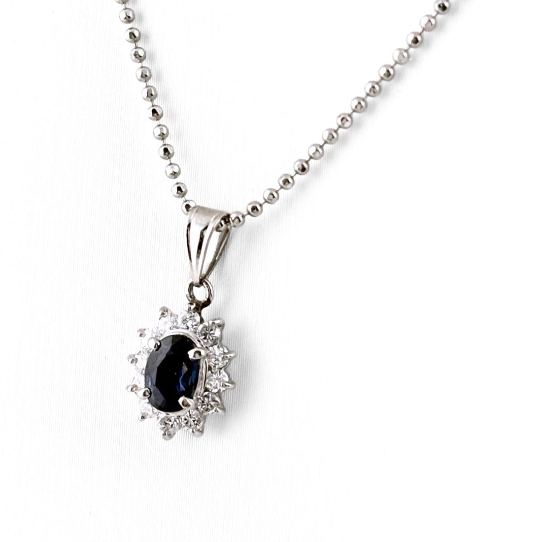 SAPPHIRE DESIGN NECKLACE PLATINUM PENDANT MELEE DIAMOND: Sapphire design necklace Platinum Pendant melee diamond Brand: Unbranded Type/Style: Necklace Material: Pt850, Main Stone sapphire Color: PT Size: Chain / code 39cm(15.4") Total length of the pendant