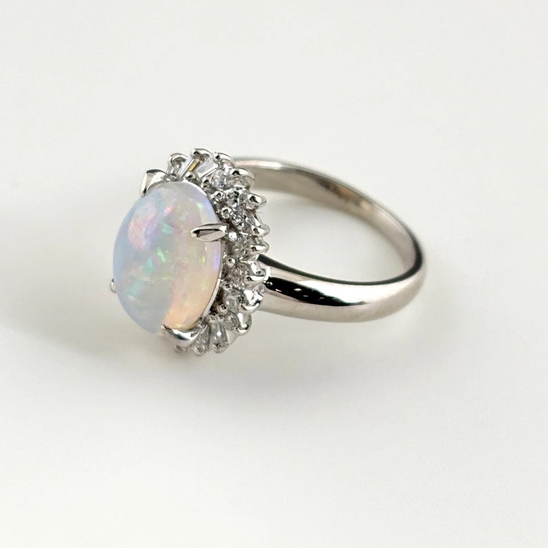 OPAL DESIGN RING PLATINUM MELEE DIAMOND: opal design ring Platinum melee diamond Brand: Unbranded Type/Style: Ring Material: Pt900, Main Stone opal Color: PT Size: US 5.5 to 6 Accessories: None Accessories Notice: When purchasing