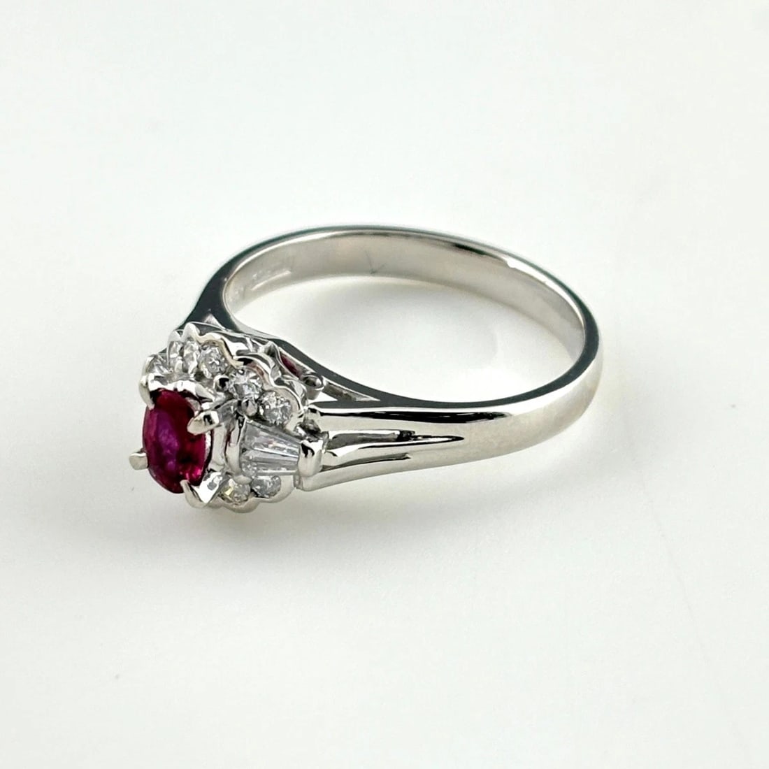 RUBY DESIGN RING PLATINUM MELEE DIAMOND: ruby design ring Platinum melee diamond Brand: Unbranded Type/Style: Ring Material: Pt900, Main Stone Ruby Color: PT Size: US 5.5 to 6 Accessories: None Accessories Notice: When purchasing