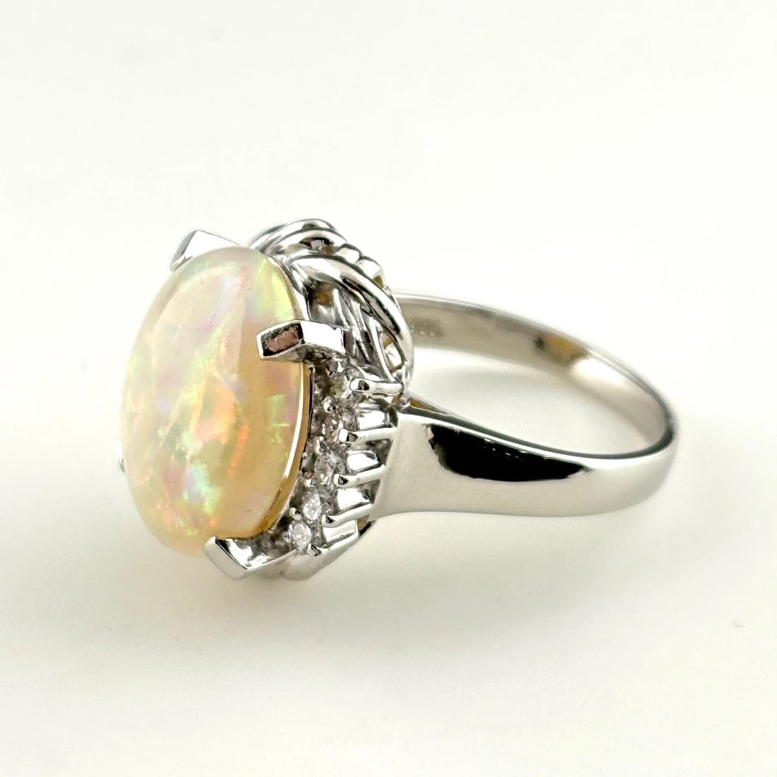 OPAL DESIGN RING PLATINUM RING MELEE DIAMOND RING: opal design ring Platinum ring melee diamond Ring Brand: Unbranded Type/Style: Ring Material: Pt900, Main Stone opal Color: PT Size: US 6.5 to 7 Accessories: None Accessories Notice: When
