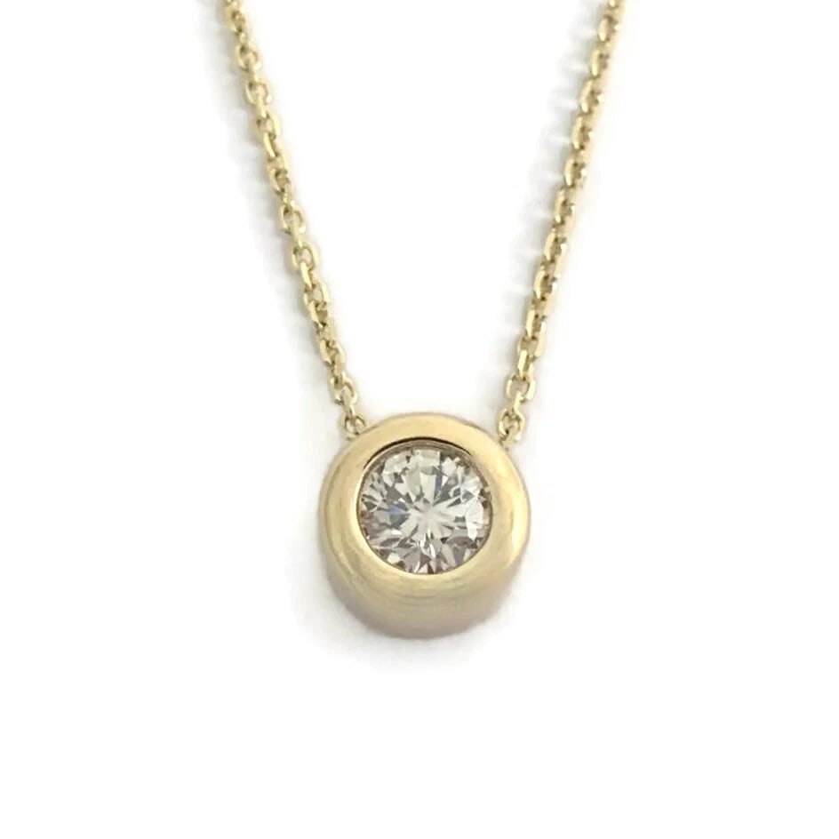 SOLITAIRE DIAMOND BEZEL PENDANT NECKLACE 14K YELLOW GOLD: Solitaire Diamond Bezel Pendant Necklace 14K Yellow Gold Brand: Unbranded Type/Style: Necklace Material: 14K Yellow Gold, Main Stone Natural Color: Gold Size: Length: 16 inches Pendant: 8.7 mm Acc