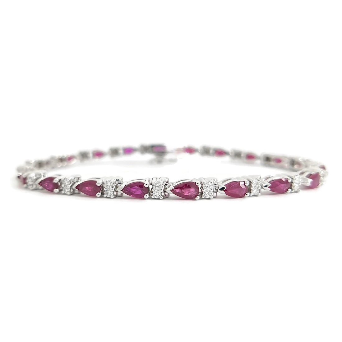 PEAR RUBY DIAMOND GEMSTONE TENNIS BRACELET 14K WHITE GOLD: Pear Ruby Diamond Gemstone Tennis Bracelet 14K White Gold Brand: Unbranded Type/Style: Bracelet Material: 14K White Gold, Main Stone Natural Color: Red Size: Length: 7 inches Width: 3.7 mm Accesso