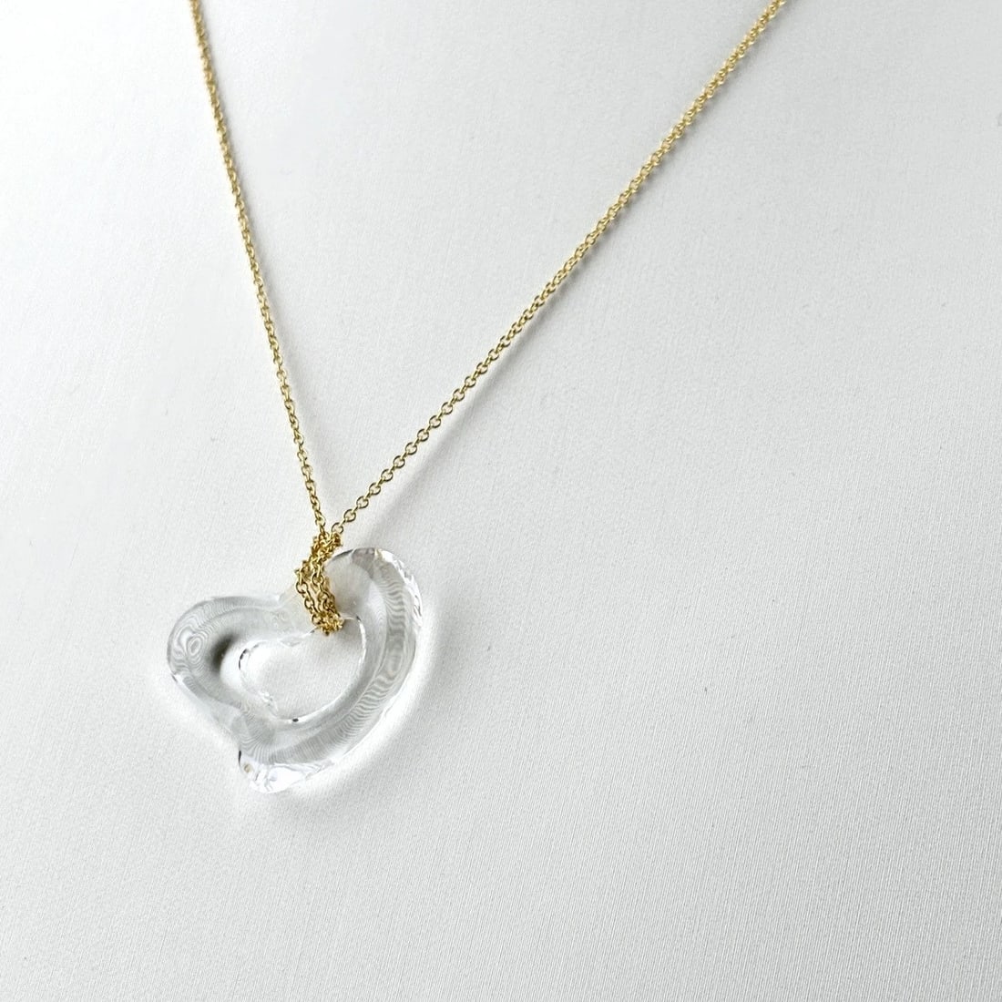 TIFFANY&CO. OPEN HEART ROCK CRYSTAL NECKLACE: TIFFANY&Co. Open Heart Rock Crystal Necklace Brand: TIFFANY&Co. Type/Style: Necklace Material: 18K YG Color: YG Size: Chain / code 38.5cm(15.2") Pendant size 18.8×22.7mm(0.7") Accessories: None