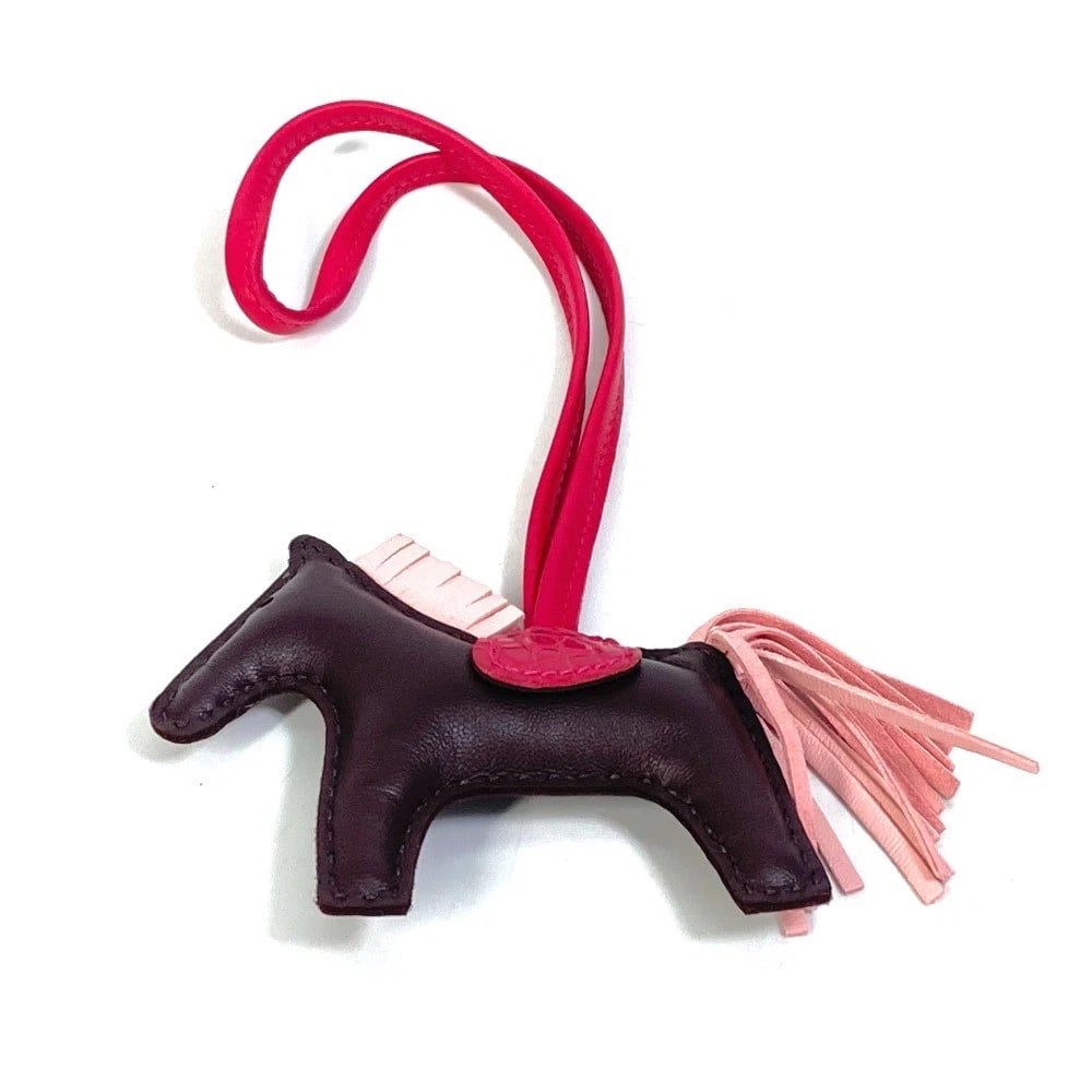 UNHERMES STRAP RODEO PM TOUCH ACCESSORY BAG: UNHERMES strap Rodeo PM Touch Accessory Bag Brand: HERMES Type/Style: Bag Charm Material: Anyo Miro Color: Brown Size: W3.5?H2.8inch / W9cm?H7cm Total Length: 9.1inch / 23cm Accessories: None