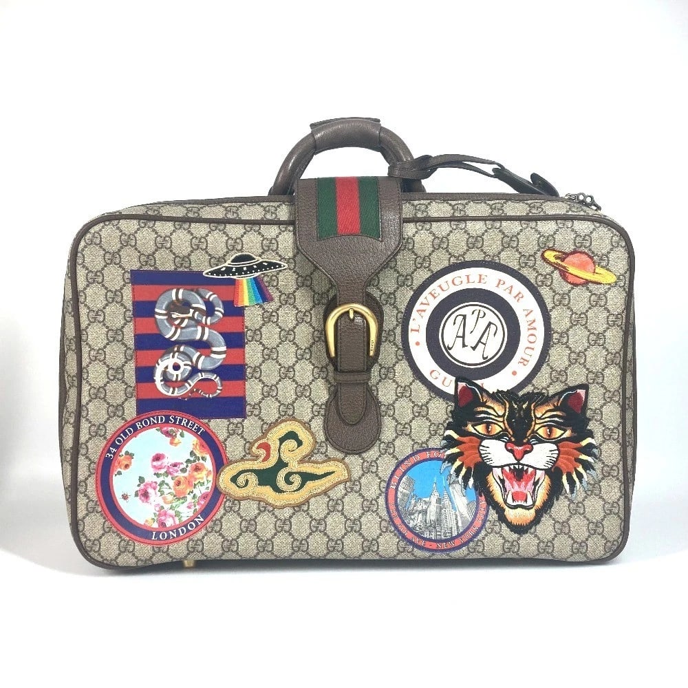 GUCCI GG SUPREME ANGRY CAT SNAKE PATCH BAG: GUCCI GG Supreme Angry Cat Snake Patch Bag Brand: GUCCI Type/Style: Duffle Bag Material: GG Supreme Canvas Color: Beige / Multicolor Size: W13.6?H10.2?D7.1inch / W34.5cm?H26cm?D18cm Accessories: N