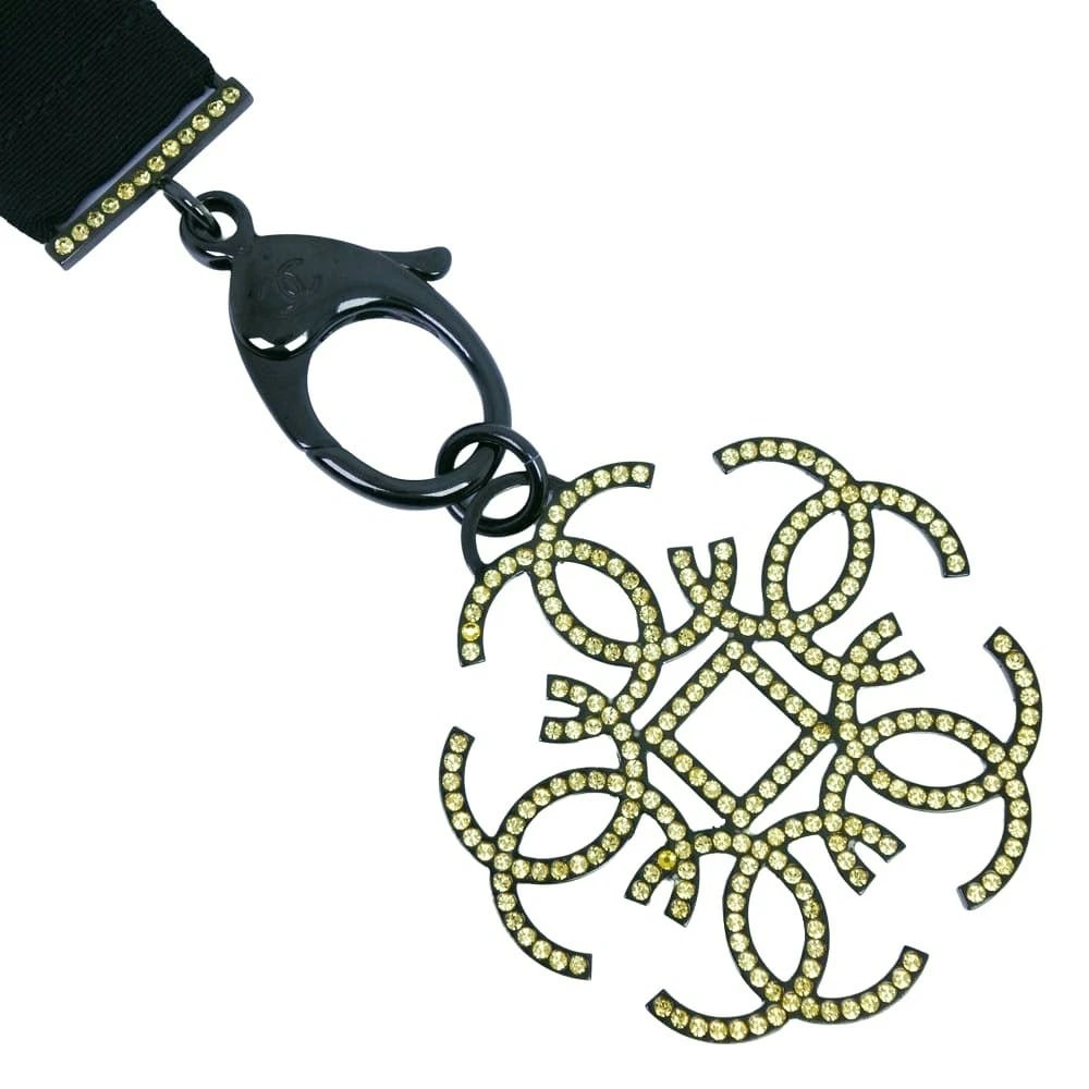 CHANEL STRAP NECKLACE BLACK/YELLOW RHINESTONE: CHANEL strap Necklace black/yellow Rhinestone Brand: CHANEL Type/Style: Necklace Material: Rhinestone Color: black Size: Size(CM) Neck around?69cm Top?W60mm x H64mm Accessories: None Acces