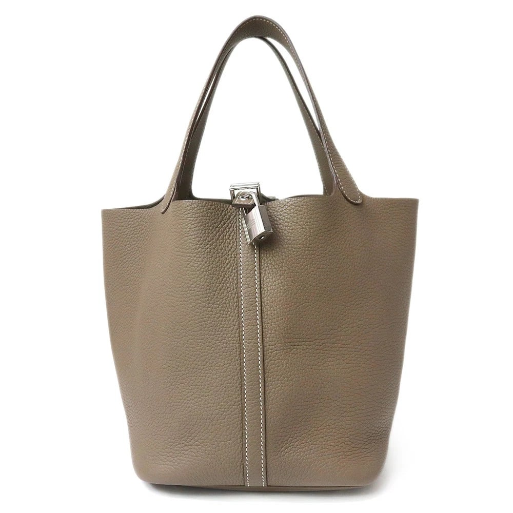 HERMES PICOTIN ETOUPE ETOUPE Y HANDBAG: HERMES Picotin Etoupe Etoupe Y Handbag Brand: HERMES Type/Style: Handbag Material: Taurillon Clemence Color: Etoupe Size: W: 22cm x H: 22cm x D: 18cm Accessories: None Accessories Notice: When
