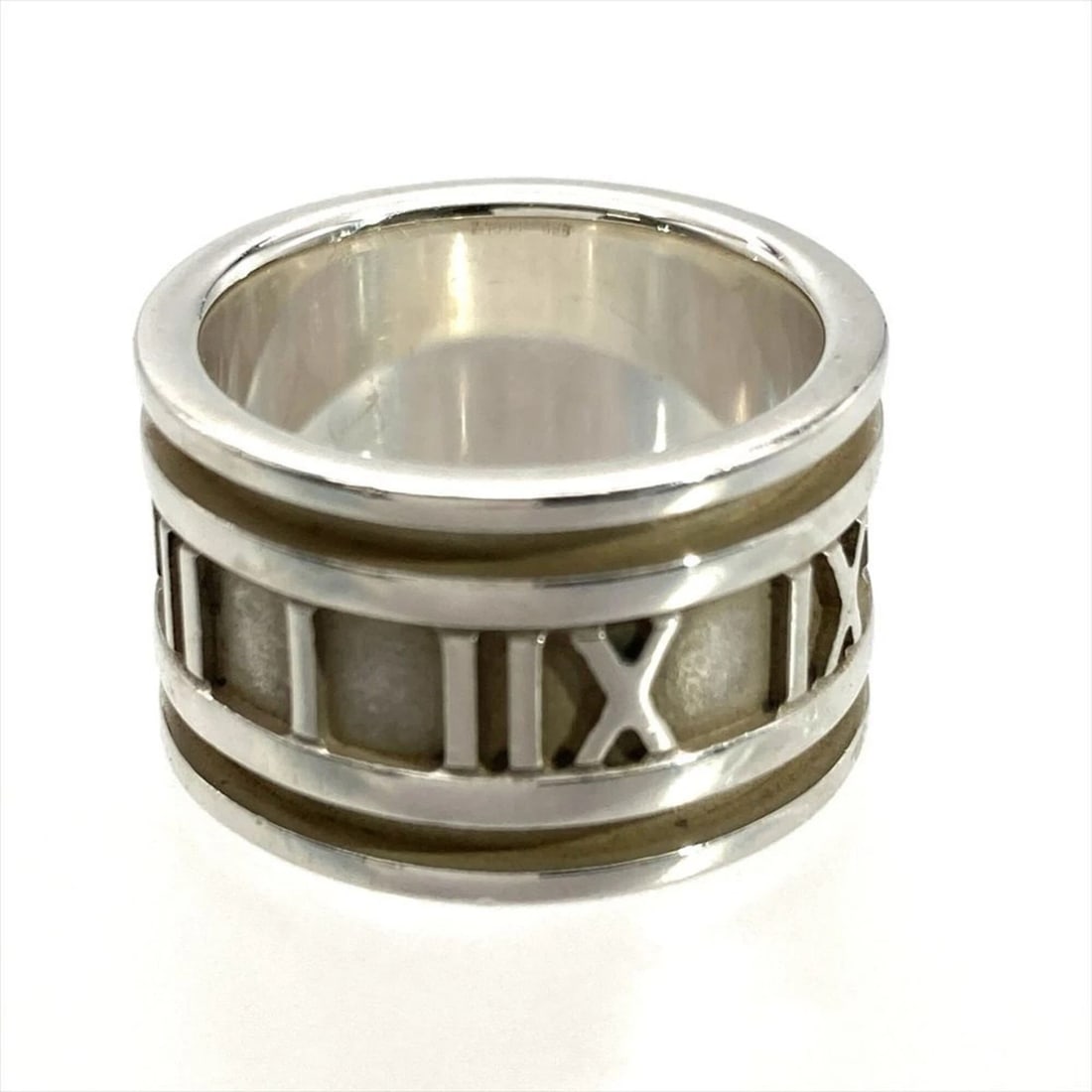 TIFFANY & CO. ATLAS WIDE RING: Tiffany & Co. Atlas Wide Ring Brand: Tiffany Type/Style: Band ring Material: Color: Silver Size: 4.5 US Accessories: None Accessories Notice: When purchasing pre-owned goods, please refer to the