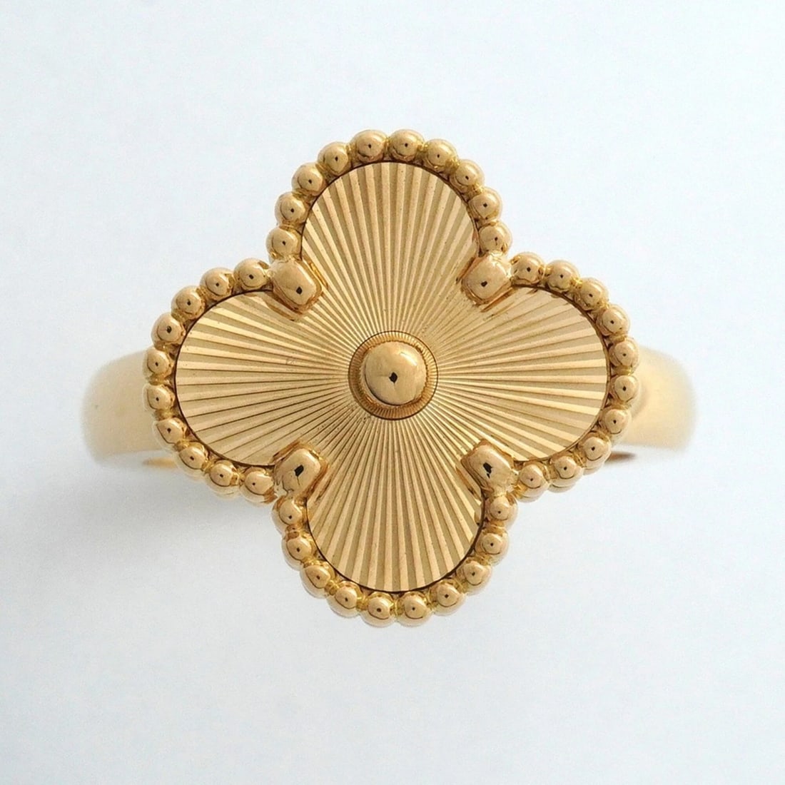 VAN CLEEF & ARPELS ALHAMBRA GUILLOCHE RING: Van Cleef & Arpels Alhambra Guilloche Ring Brand: Van Cleef & Arpels Type/Style: Band ring Material: Color: Yellow gold Size: 6.5 US Accessories: None Accessories Notice: When purchasing p