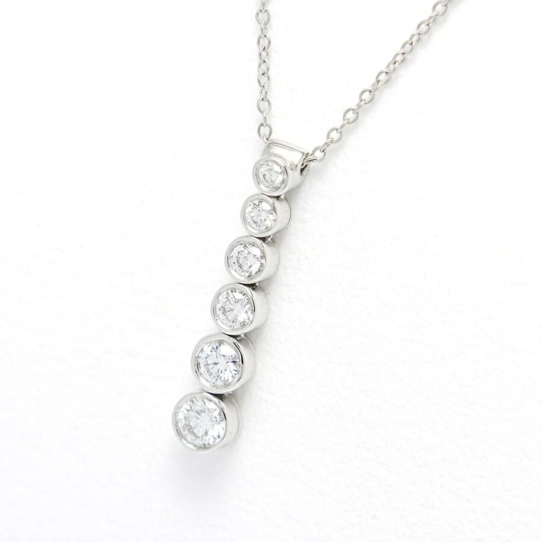 TIFFANY & CO. JAZZ DROP NECKLACE: Tiffany & Co. Jazz Drop Necklace Brand: Tiffany Type/Style: Necklace Material: Color: Platinum Size: Neck Circumference 39 cm / 15.35'' Pendant Size 22mm x 4.5mm / 0.86'' x 0.17'' Accessories: None