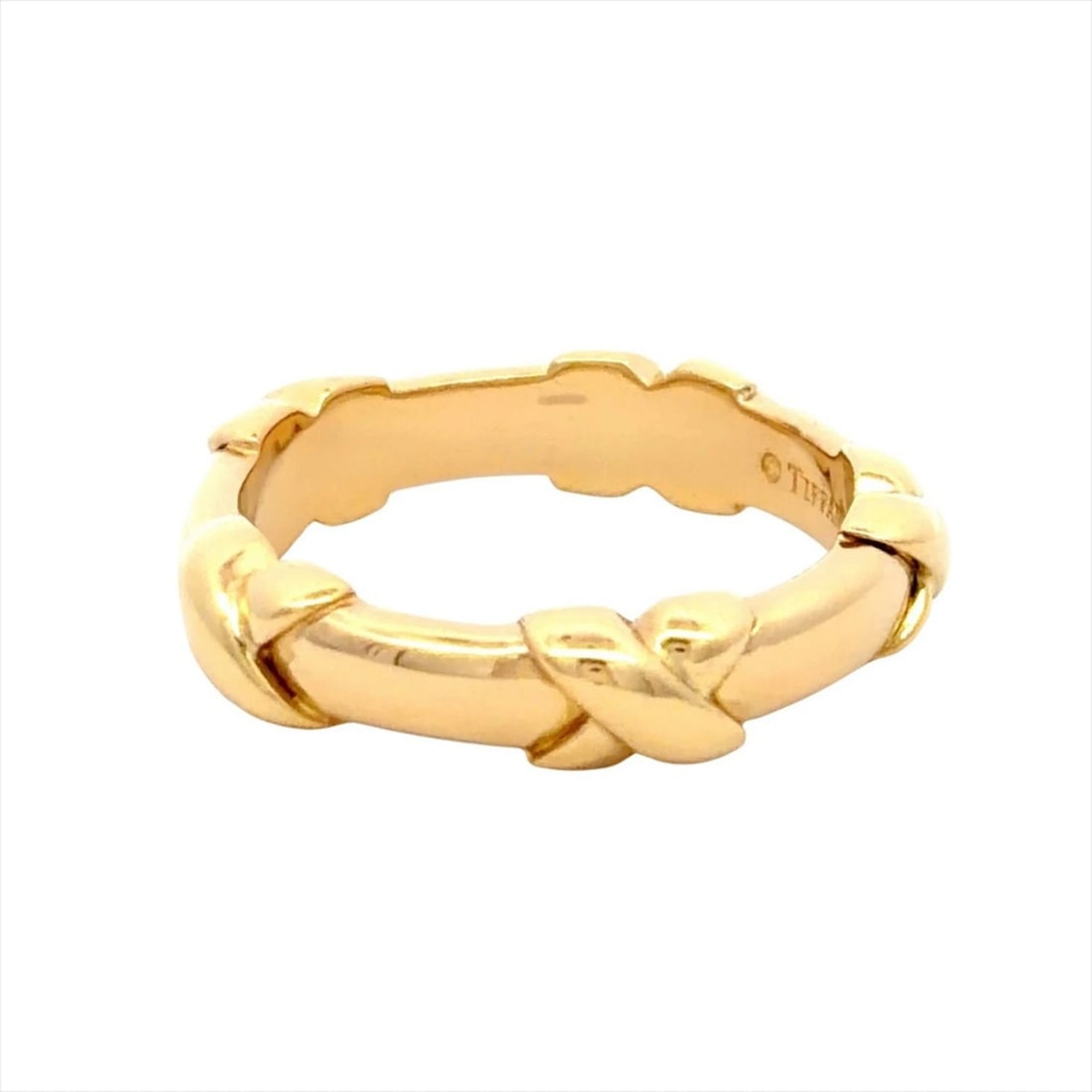 TIFFANY & CO. SIGNATURE CROSS RING: Tiffany & Co. Signature Cross Ring Brand: Tiffany Type/Style: Band ring Material: Color: Yellow gold Size: 5.5 US Accessories: None Accessories Notice: When purchasing pre-owned goods, please refer