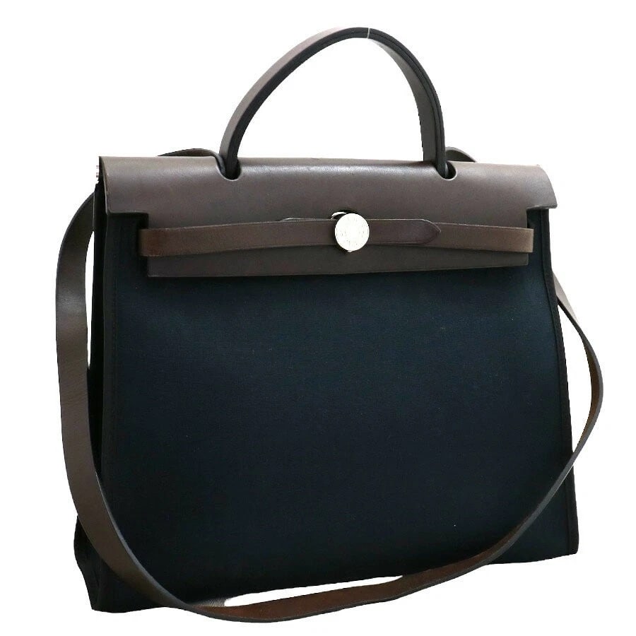 HERMES AIRBAG ZIP PM HANDBAG SHOULDER BAG: Hermes Airbag Zip PM Handbag Shoulder Bag Brand: Hermes Type/Style: Bag Material: Exterior Material Canvas x Leather Color: Exterior Color Navy x Brown Size: H (Height): 25cm x W (Width): 31cm (bottom