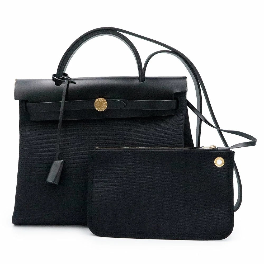 HERMES HERBAG ZIP PM 31 HANDBAG SHOULDER BAG: Hermes Herbag Zip PM 31 Handbag Shoulder Bag Brand: Hermes Type/Style: Bag Material: Exterior Material Vache Hunter Leather / Toile H Canvas Color: Exterior Color Black Size: Height: 9.8 inches (25 cm